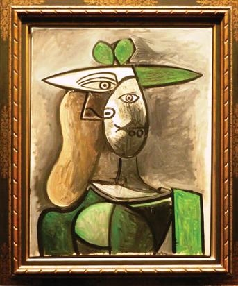  picasso woman with green hat.