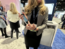 Guerbet's Celeste Consoer demonstrates the company's new Android App at RSNA 2023.