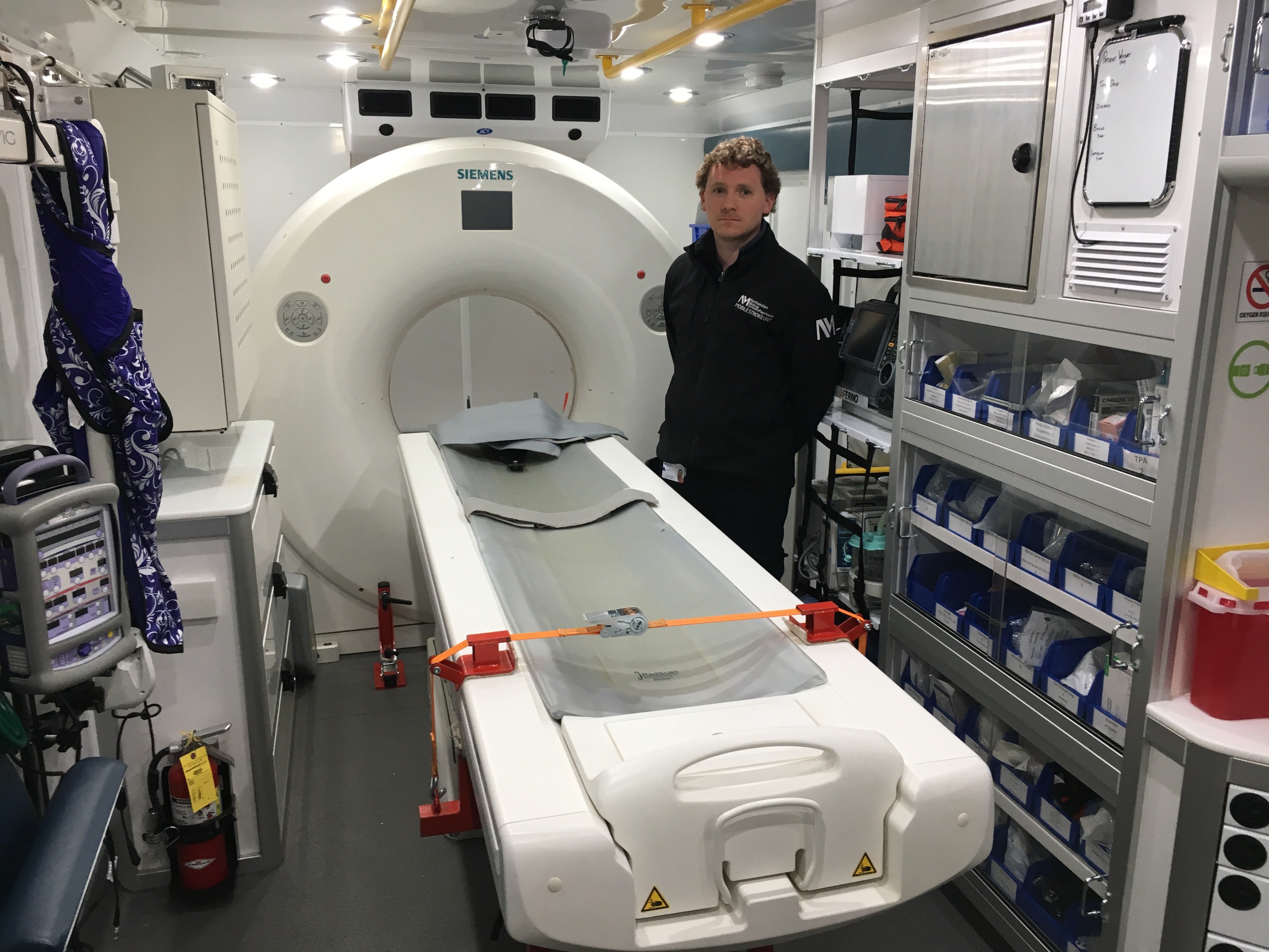 Peter Juodka, RT(CT) operates the 16-slice Siemens Somatom Scope CT scanner in the mobile stroke unit to assess stroke patients immediately at the call site. 