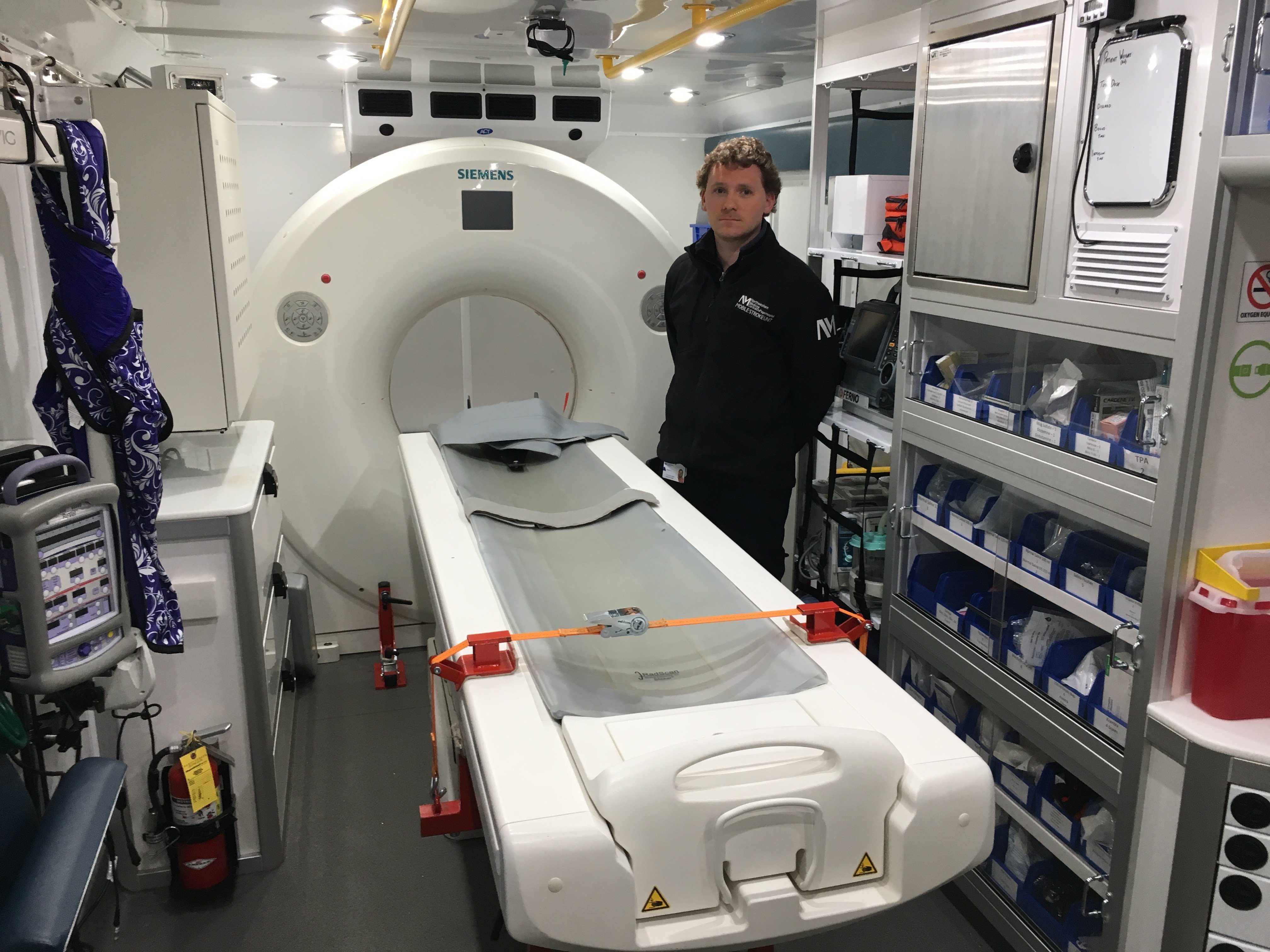 Peter Juodka, RT(CT) operates the 16-slice Siemens Somatom Scope CT scanner in the mobile stroke unit to assess stroke patients immediately at the call site.