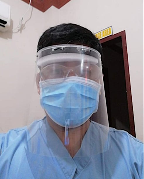 Improvised PPE face mask worn by radiology technologist Dodge Moises at Sen. Gerardo M. Roxas Memorial District Hospital in Iloilo City, Philippines. It was made from expired X-ray film and PVC.#COVID19 #coronavirus #SARScov2