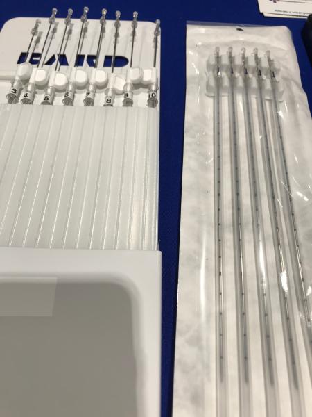 Prostate brachytherapy components from Bard in a booth display at ASTRO. Includes brachytherapy seen delivery catheters and the grid the catheters are inserted into to guide delivery.