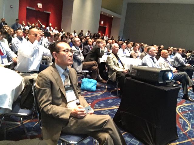 A standing room only crowd showing the level of interest interest in the new therapy concept of flash proton therapy. The idea is to deliver very high dose proton therapy in one dose so the patient does not have to return for additional fractions, which would enable better throughput and offer a convenience to the patient.