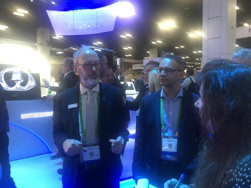 Varian's Tim Clark (L) and Ricky Sharma (R) gave a booth tour of highlights showcasing Varian's products. It was the first time Varian has exhibited in conjunction with Siemens Healthineers. The combined company addresses the full cancer care continuum, and is working to create an oncology ecosystem to support care providers along the entire cancer care journey – from screening to survivorship. 