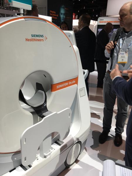 The 510k-pending Siemens Somatom On.site mobile CT scanner brings the system directly to the patient in the ICU. It features an integrated head rest and shoulder board, and moves to help position the head without moving the patient. 