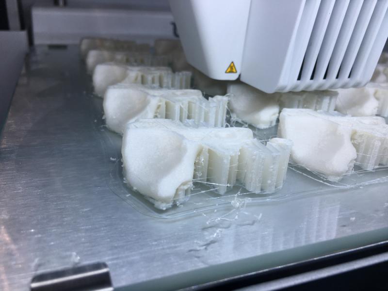 A 3-D printer in action in the CAD Blu booth at RSNA 2019. There was a dedicated area in the North hall for 3-D printing and holographic imaging.