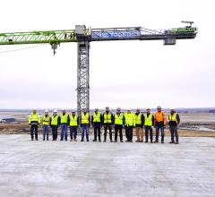 Shine executives are joined by the company’s construction managers and partners at its medical isotope production facility. The group was commemorating the facility’s achievement of weathertight status