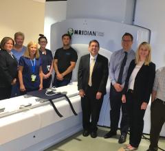 Henry Ford Hospital's ViewRay MRIdian linear accelerator system allows real-time MRI-guided radiotherapy. Shown is the support staff for this system. In the center of the photo is Benjamin Movsas, M.D., chair of radiation oncology at Henry Ford Cancer Institute. Second from the right is Carrie Glide-Hurst, Ph.D., director of translational research, radiation oncology.