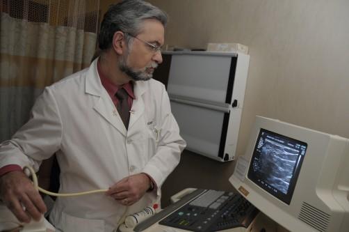 Murray Rebner, M.D., performing a breast ultrasound. Image courtesy of Beaumont Health
