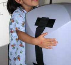 Pediatric Positioning Aid Comforts Child, Improves Image