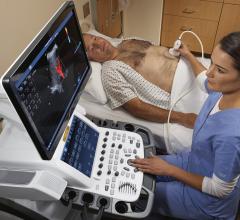  A sonographer performs an abdominal ultrasound exam with GE's Vivid E95 system