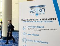 A sign listing the COVID precautions at ASTRO 2021. ASTRO required all attendees to wear masks and to be vaccinated in order to attend the annual meeting. RSNA will follow these same requirements for its 2021 meeting, which will also be in Chicago.