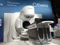 The New Elekta Harmony radiation therapy system at ASTRO 2021. It gained FDA clearance in the summer of 2021. It offers faster treatment times and a large round patient Information screen screen on the machine so their information is immediately available table side. It uses facial recognition to verify the correct patient is in the room for treatment. The speed increased, so the time a patient spends in the treatment room for lung SBRT from 30 Minutes down to under 2 minutes. SBRT prostate down from 5 minu