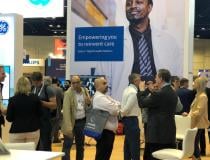 Attendees learn about Edison Health at the GE Healthcare booth at HIMSS22. 