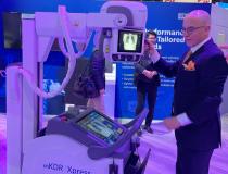 Guillermo Sander, Director of Digital Radiography at Konica Minolta Healthcare, demonstrates the mKDR Xpress at RSNA22. The system is portable, making it easier for the technologist to acquire a good image with a minimum amount of effort. 
