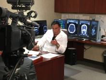 Harish Shownkeen, M.D., is one of the interventional neuroradiologists who reviews CT scans of stroke patients en route from the MSU.